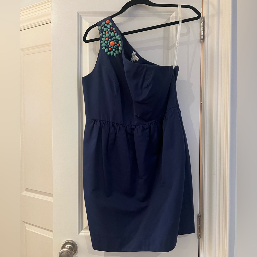 One shoulder dress with beaded detail.